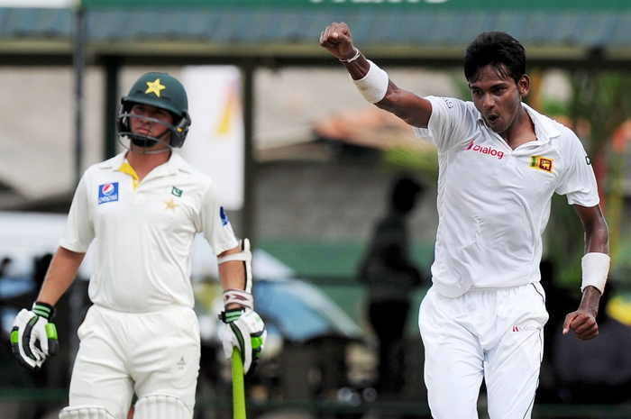 Sri Lankan cricketer Dushmantha Chameera (R) celebrates the dismissal of Pakistan cricketer Zulfiqar Babar during the opening day of the second Test between Sri Lanka and Pakistan at the P Sara Oval Cricket Stadium in Colombo on Thursday.