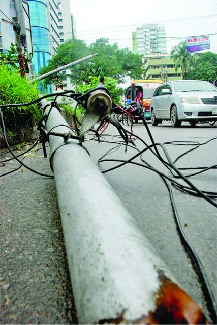 A major tragedy could have occurred as a big and old electric pole broke down on the street in city's Bijoynagar shortly before Iftar time due to heavy impact of Thursday evening's torrential rains