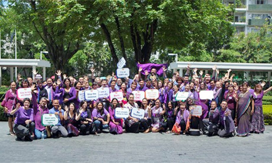 Delegates wearing the colour purple pose for a photo in support of the #MyPurpleSchool campaign, launched during the Asia-Pacific Consultation on School Bullying on the Basis of Sexual Orientation and Gender IdentityExpression in Bangkok. Photo: UNESCOU
