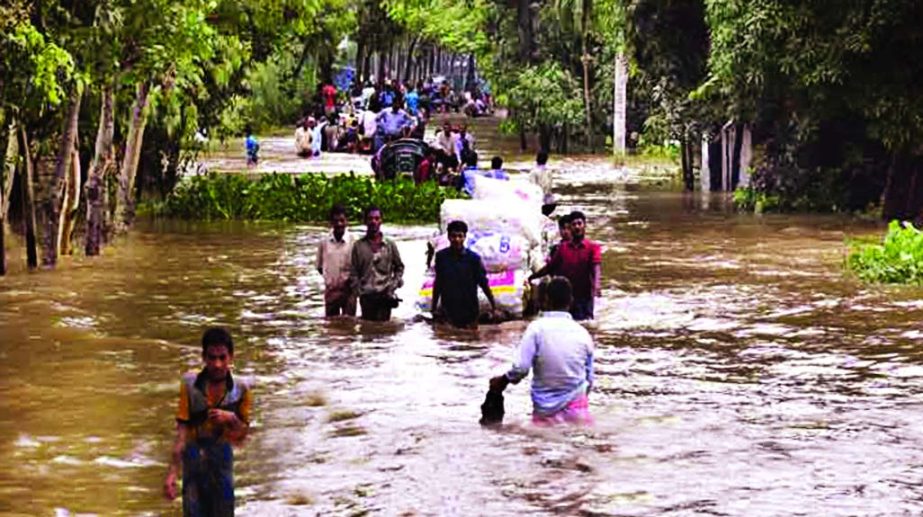 Eleven upazilas of north-south Chittagong were inundated following the incessant rains and flash floods rendering thousands of people marooned. This photo was taken on Friday.