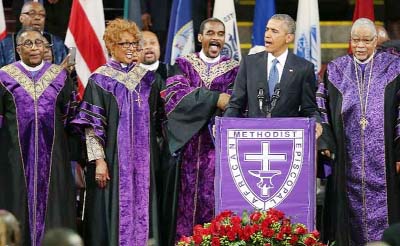 US President Barack Obama sings "Amazing Grace" as he delivers the eulogy for South Carolina state senator and Rev Clementa Pinckney during Pinckney's funeral service in Charleston, South Carolina.