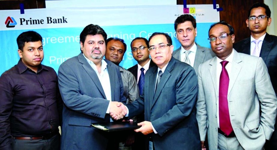 Habibur Rahman, Deputy Managing Director of Prime Bank Ltd and Amer Ahmed, Director, Business Development of Ascent Group, exchanging documents of a deal recently. Prime Bank will collect tuition and other fees of students of Scholastica (pvt) Ltd.