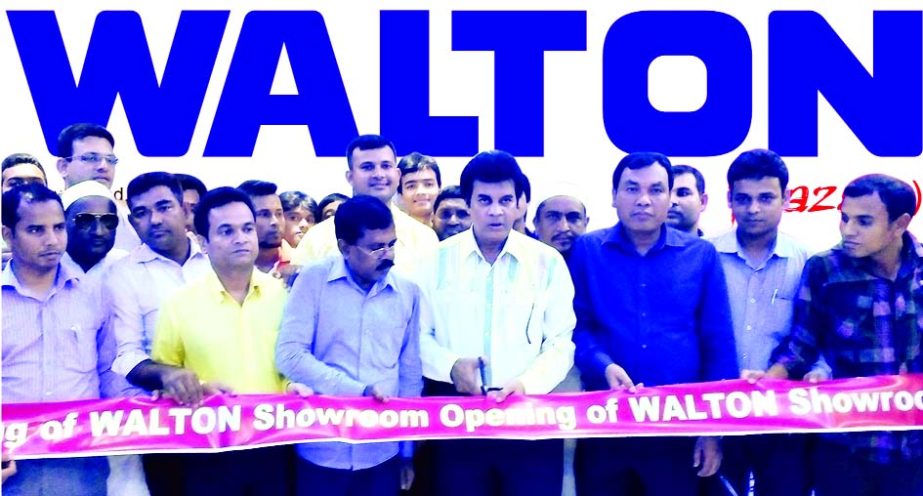 Walton Brand Ambassador and film Actor Ilias Kanchan inaugurating a showroom at Kishoreganj recently. Md Humayun Kabir, Executive Director (PR & Media), Md Shahjada Salim, Deputy Director, Static Ad & Beautification, Md Amdadul Haque, Deputy Director, M