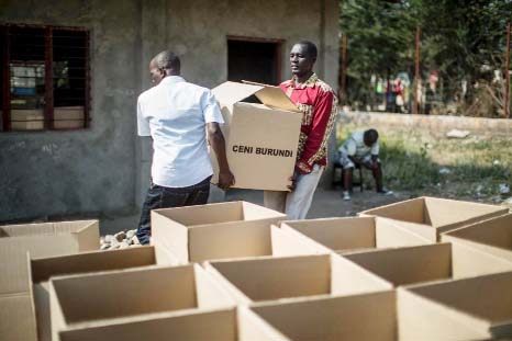 Officials carry boxes of electoral material to be sent to different polling stations in Cibitoke, Bujumbura.