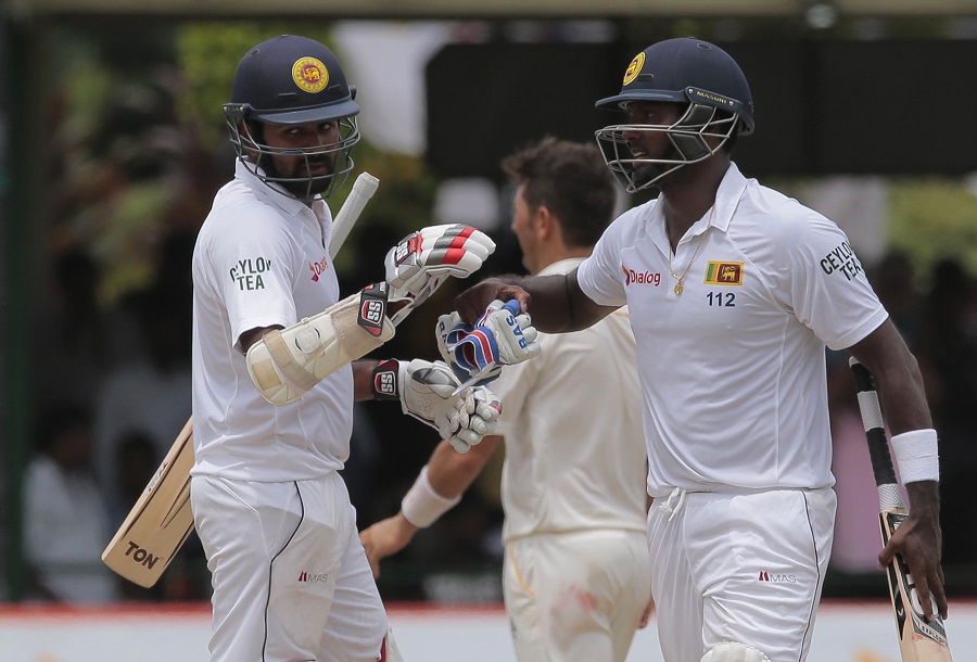 Angelo Mathews congratulates Lahiru Thirimanne on the 5th day of 2nd Test between Sri Lanka and Pakistan at Colombo on Monday.