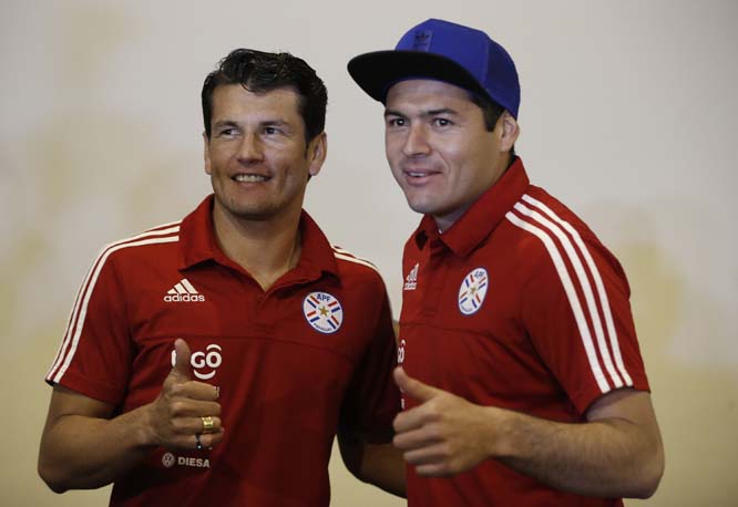 Paraguay's soccer players Pablo Aguilar (right) and Nelson Valdez pose for a photo during a press conference in Concepcion, Chile on Sunday. Paraguay will face Argentina in a Copa America soccer match today (Tuesday).