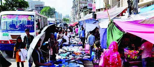 On the eve of Eid-ul Fitr, most of the city footpaths have already turned into makeshift markets. And so, it becomes impossible for the pedestrians to use the footpaths as, in most cases, these are occupied by small traders and hawkers who run brisk busin