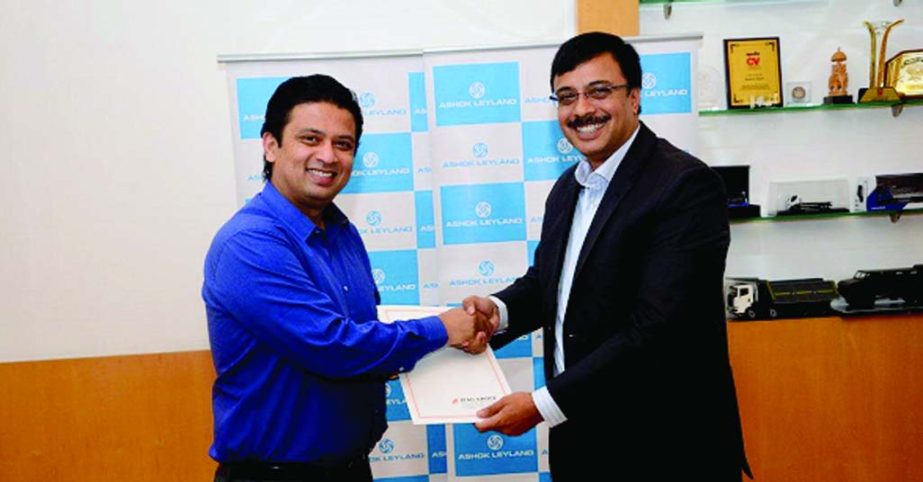Taskeen Ahmed, Managing Director of IFAD Autos Ltd and Vinod Dasari, Managing Director of Ashok Leyland Ltd India, exchanging a deal documents for setting up an Assembling Plant of Ashok Leyland vehicles in Bangladesh.