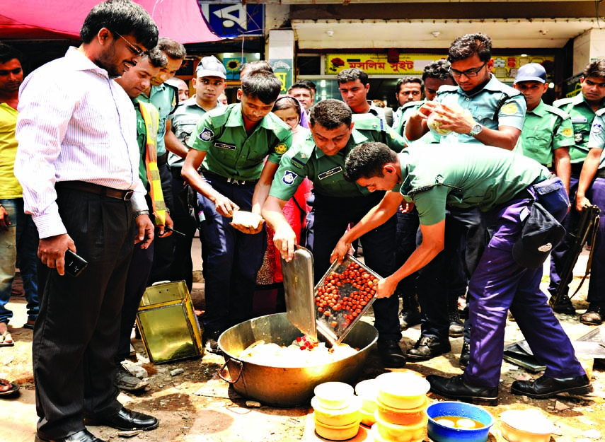 A mobile court conducted by law-enforcers poured adulterated sweet into the drain. The snap was taken from a factory of Gandaria in the city on Wednesday.