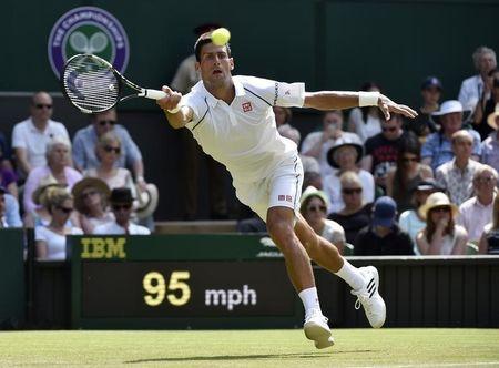 Novak Djokovic of Serbia hits a shot during his match against Jarkko Nieminen of Finland at the Wimbledon Tennis Championships in London on Wednesday.