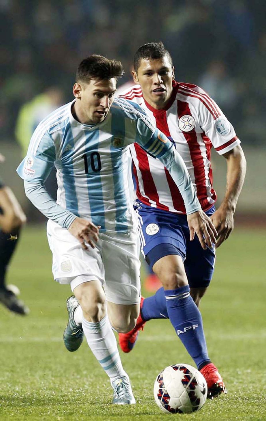 Argentina's Lionel Messi controls the ball past Paraguay's Paulo Cesar Da Silva during a Copa America semifinal soccer match at the Ester Roa Rebolledo Stadium in Concepcion, Chile on Tuesday.