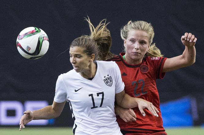 United States' Tobin Heath (left) challenges Germany's Tabea Kemme during the first half of a semifinal in the Women's World Cup soccer tournament in Montreal, Canada on Tuesday.