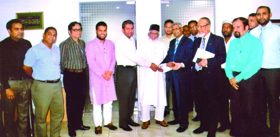 Arun Kumar Saha, Chief Executive Officer of Eastland Insurance Co Ltd, handing over a Marine Cargo Claim cheque to Md Mizanur Rahman, Chairman of PHP Group, at the latter's office in Chittagong recently.