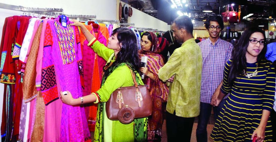 Eid shopping at Bashundhara Super Market in city on Thursday.