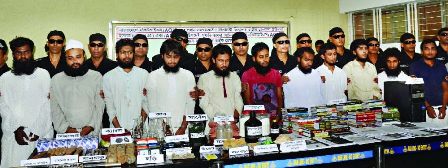 Twelve militants including AQIS Coordinator in Bangladesh were arrested by RAB with huge explosives and bomb making equipment from city's separate places on Wednesday night.
