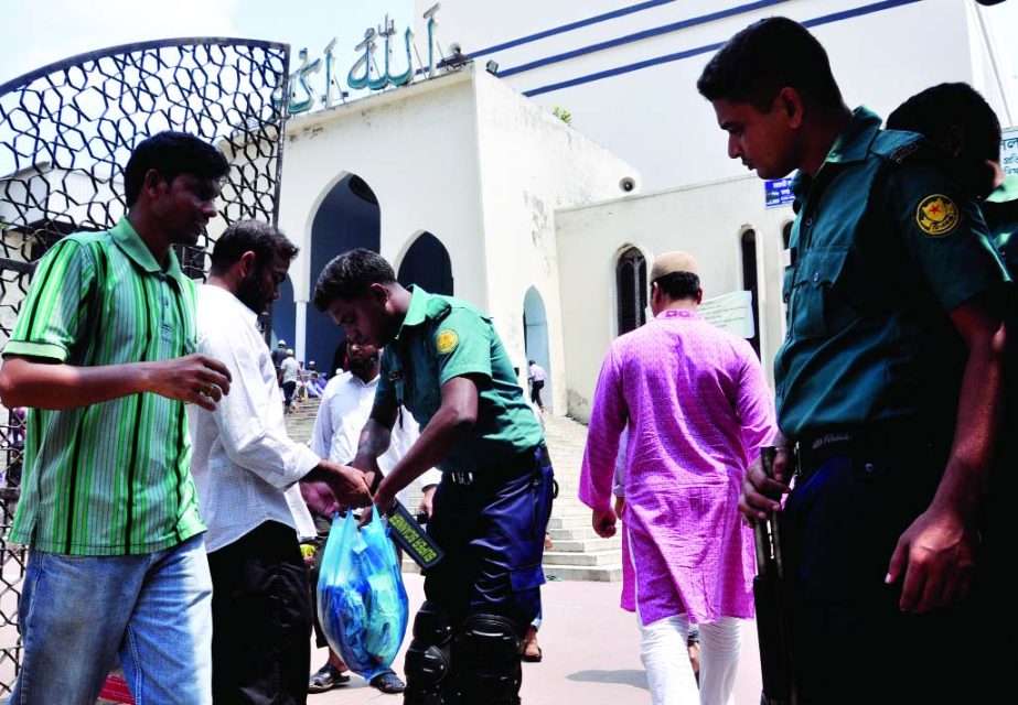 Law-enforcers checking the people at the entrance of Baitul Mokarram National Mosque in the city on Friday for security measures as some Islamic organizations called a demonstration programme demanding re-arrest of former minister Latif Siddiqui.