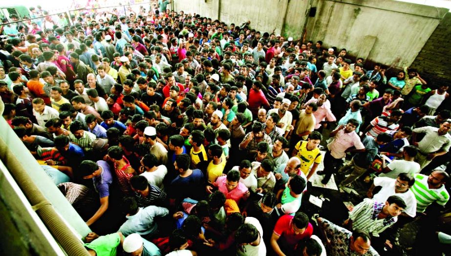 Thousands of home-bound people making rush for buying advance tickets for Eid festival at Gabtali bus terminal beginning from Friday.