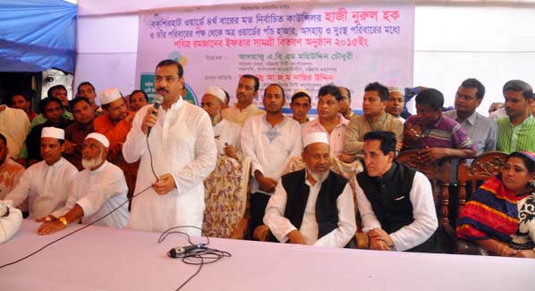 CCC Mayor AJM Nasir Uddin distributing rice and dal among the distressed people at Ward No 35 in the city yesterday.