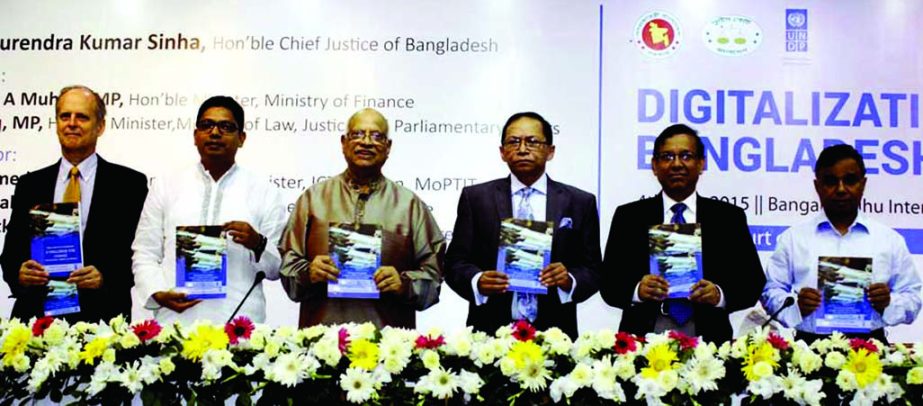 Chief Justice Surendra Kumar Sinha along with other distinguished guests holds the copies of a book titled 'Digitalisation of Bangladesh Judiciary' at a seminar organized by the Supreme Court at Bangabandhu International Conference Center in the city o