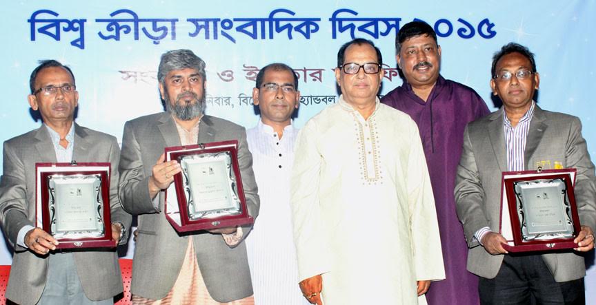 Khairul Islam Shahin, Dilu Khondker, Aminul Haque Mallick, the three accorded journalists by Bangladesh Sports Press Association (BSPA) pose with the chief guest State Minister for Youth and Sports Biren Sikder at the Shaheed (Captain) M Mansur Ali Nation