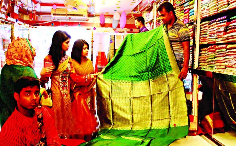 Eid shopping is peaking up. Photo shows price of this saree being charged Tk 2.30 lakh at city's Mirpur Benarashi Palli on Saturday.
