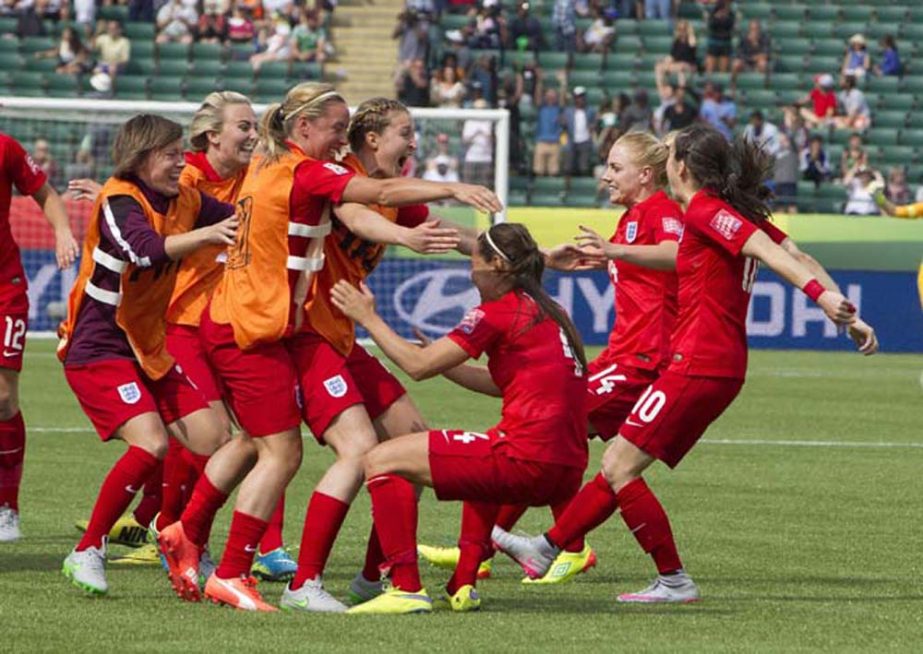 England celebrate a penalty kick goal against Germany during extra time in the FIFA Women's World Cup third-place soccer match in Edmonton, Alberta, Canada on Saturday.