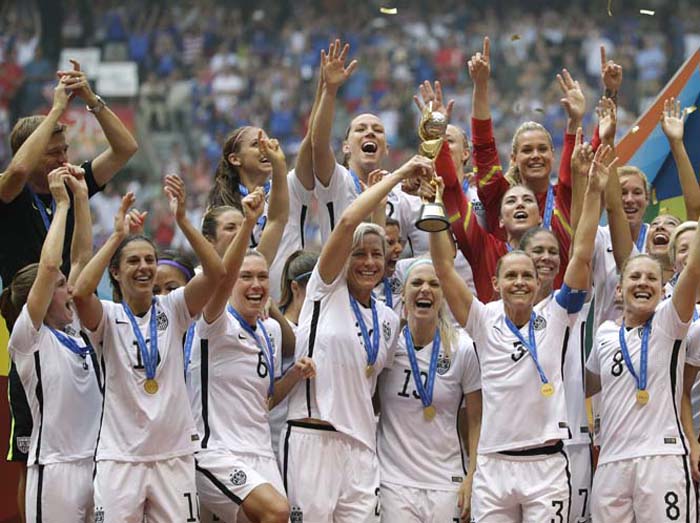 The United States Women's National team celebrating with the trophy after they beat Japan 5-2 in the FIFA Women's World Cup soccer championship in Vancouver, British Columbia, Canada on Sunday.