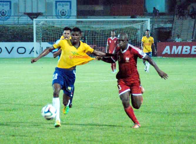 An action from the football match of the Manyavar Bangladesh Premier League between Sheikh Jamal Dhanmondi Club Limited and Soccer Club, Feni at the Bangabandhu National Stadium on Monday. Sheikh Jamal Dhanmondi Club won the match 6-2.