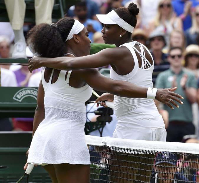 Serena Williams of the USA embraces Venus Williams of the USA after winning their match at the Wimbledon Tennis Championships in London on Monday.