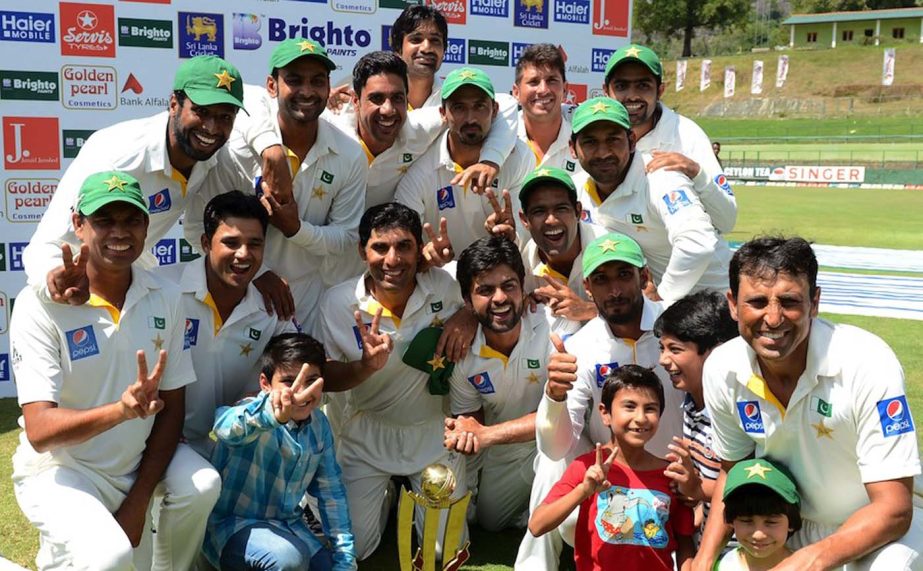 Pakistan cricketers pose after their team's series victory following the third and final Test cricket match between Sri Lanka and Pakistan at the Pallekele International Cricket Stadium in Pallekele on Tuesday.