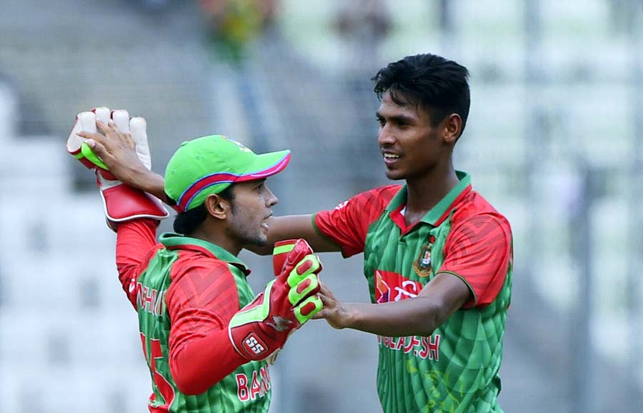 Mustafizur Rahman (R) and Mushfiqur Rahim celebrate the wicket of Faf du Plessis during the 2nd T20I match between Bangladesh and South Africa at the Mirpur Sher-e-Bangla National Cricket Stadium on Tuesday.