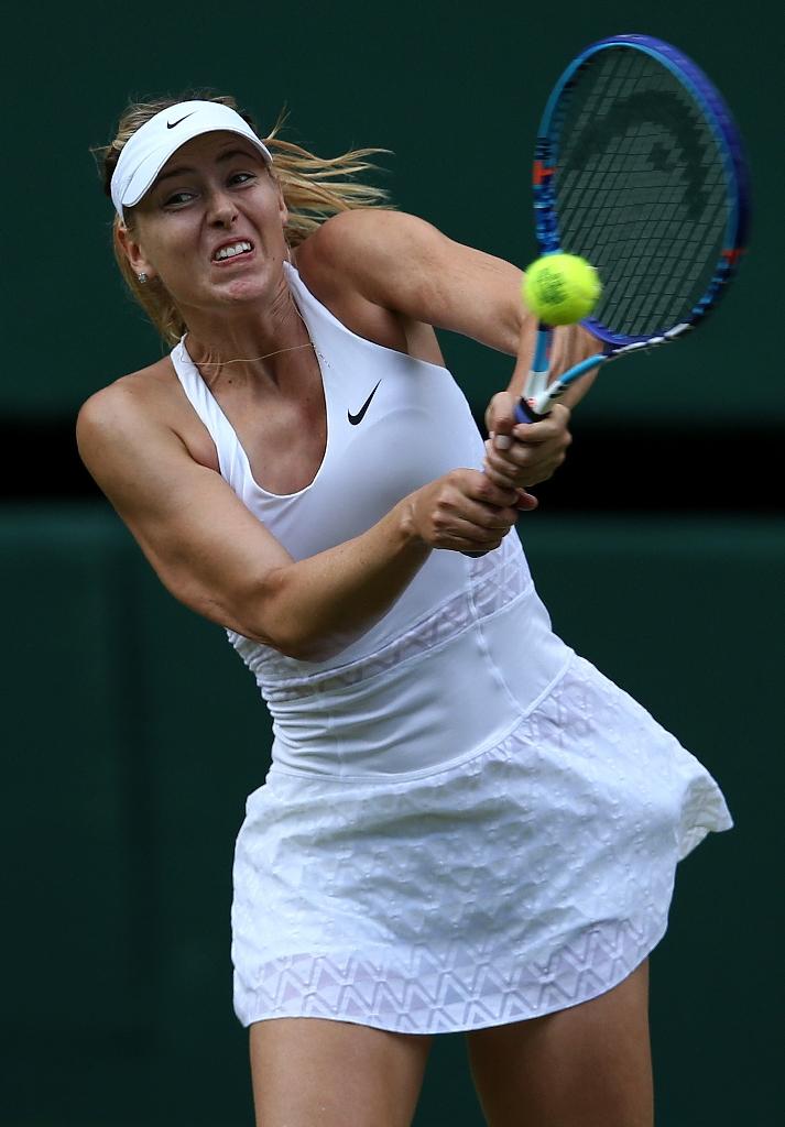 Russia's Maria Sharapova returns to US player Coco Vandeweghe during their women's quarter-finals match at Wimbledon on Tuesday.