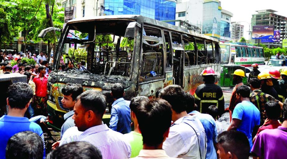 Angry mob torched a bus after a minor boy was crushed under its wheel near Science Laboratory in Dhanmondi on Wednesday.