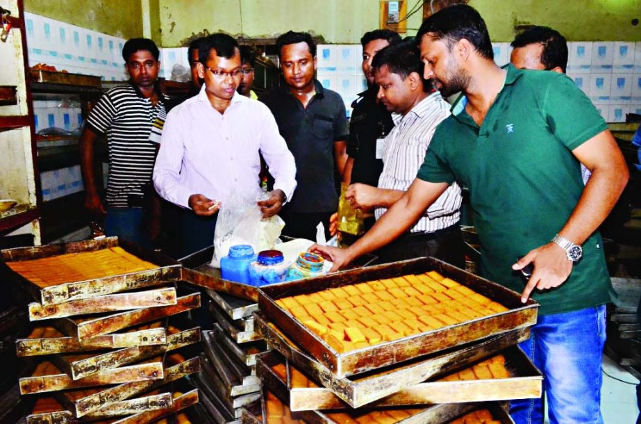 RAB mobile team raided a bakery factory in city's Arambag area on Wednesday and fined the owner Tk one lakh for producing adulterated biscuits.