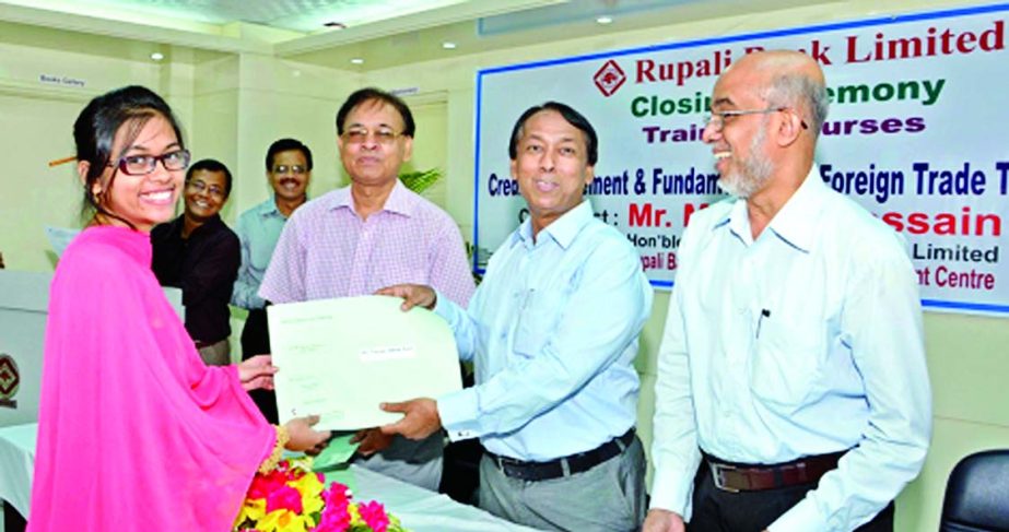 Monzur Hossain, Chairman of Rupali Bank, distributing certificates among the participants of a training course on "Credit Management and Fundamentals of Foreign Trade Transactions" at the bank's Training Academy on Thursday.