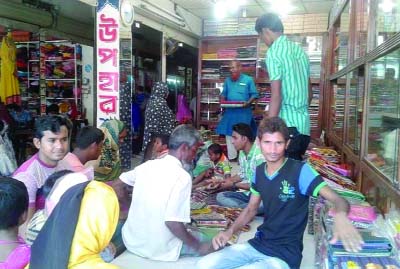 GAFARGAON(Mymensingh): A busy shopping certre ahead of Eid at Sarkar Manson in Gafargaon Upazila yesterday.