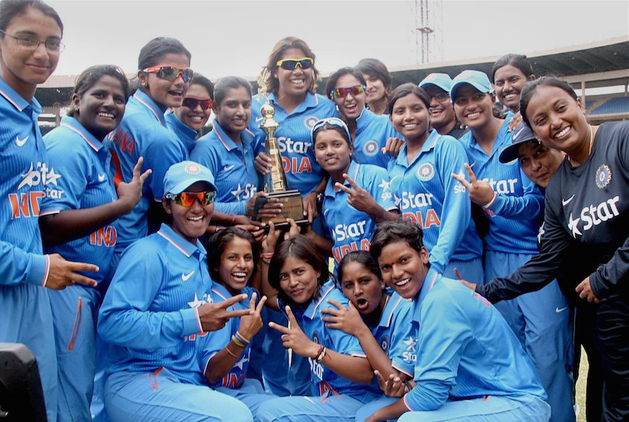 Members of Indian women's cricket team celebrate with trophy as they won ODI Series against New Zealand by 3-2 at Chinnaswamy stadium in Bangalore on Wednesday.