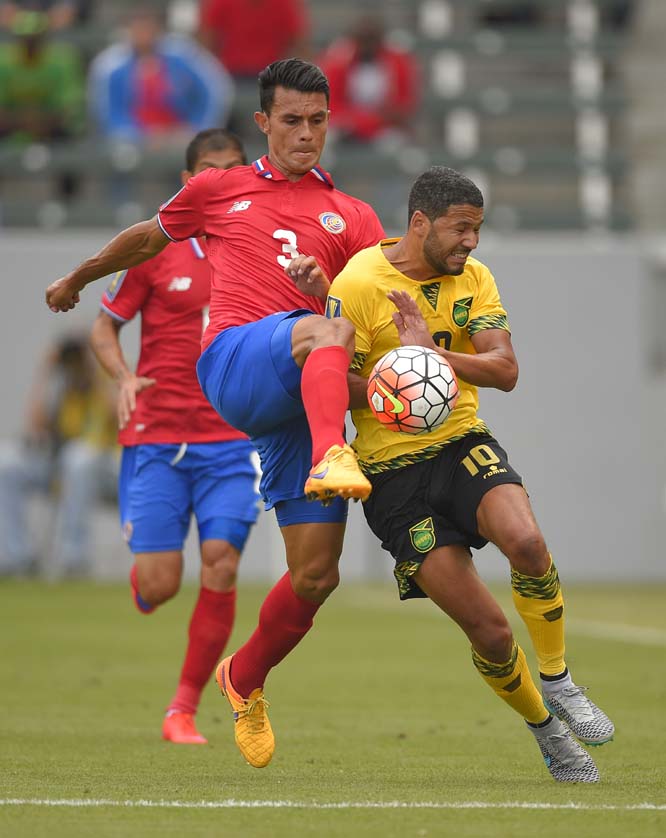 Costa Rica's Giancarlo Gonzalez (left) and Jamaica's Joel McAnuff vie for the ball during the first half of CONCACAF Gold Cup soccer match in Carson, Calif on Wednesday.
