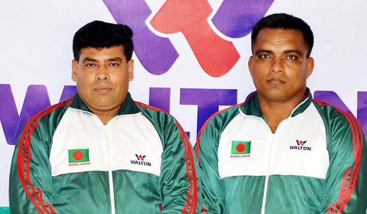 Team Leader of Bangladesh Wrestling team and First Senior Additional Director of Walton FM Iqbal Bin Anwar Dawn (left) and participant Billal Hossain pose for a photo session on Thursday before leaving the city for China to take part in the 11th Asian Wre