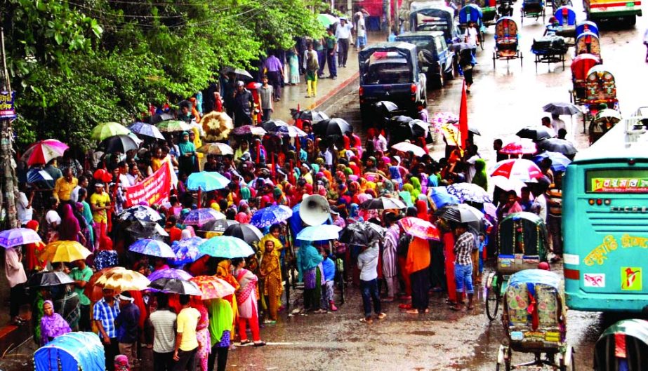 RMG workers staged a demonstration in front of the Jatiya Press Club demanding payment of arrears defying incessant rains on Thursday.