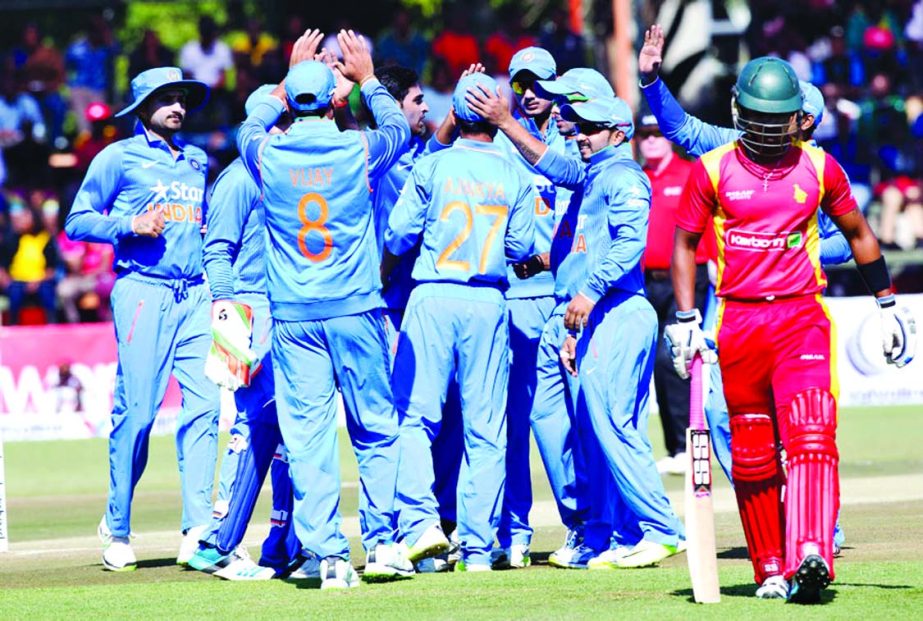 The Indian players celebrate the wicket of Chamu Chibhabha during the 1st ODI against Zimbabwe at Harare on Friday.