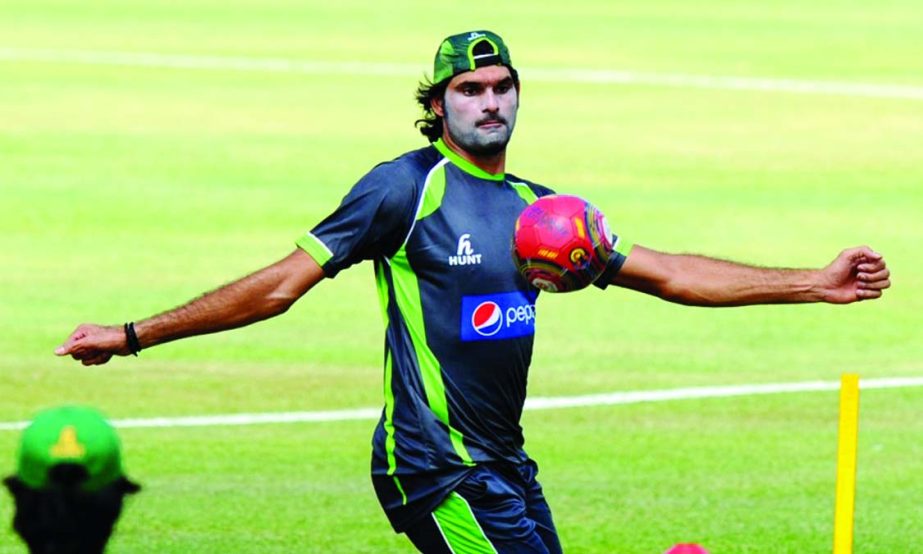 Pakistan cricketer Mohammad Irfan plays football during a practice session at the Rangiri Dambulla International Cricket stadium in Dambulla, some 150 kms north of Colombo on Friday, ahead of the first One-Day International match against Sri Lanka.