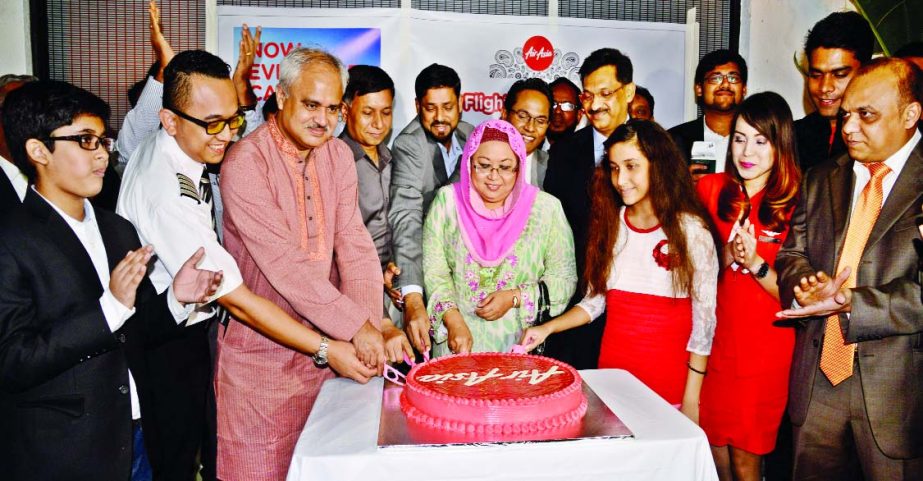 Malaysian High Commissioner Norlin Binte Othman, inaugurating Air Asia flight by cutting cake at Hazrat Shahjalal International Airport on Friday.