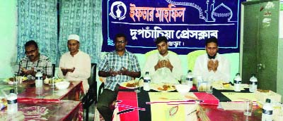 DUPCHANCHIA(Bogra): Participants at a Iftar Mahfil organised by Dupchanchai Press Club at the club premises on Friday.