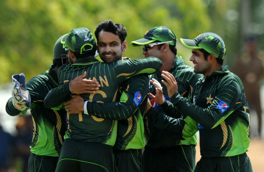 Mohammad Hafeez is mobbed by his team-mates during the 1st ODI between Sri Lanka and Pakistan at Dambulla on Saturday.