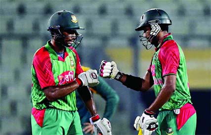 Bangladeshi cricketer Soumya (R) celebrates with teammate Mohammad Mahmudullah after hitting a boundary during the second One Day International match between Bangladesh and South Africa at the Sher-e-Bangla National Cricket Stadium in Mirpur on Sunday.