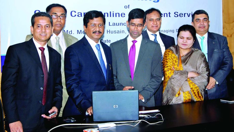 Md Mehmood Husain, Managing Director of Bank Asia Ltd, launching the Credit Card Online Statement Service at the bank's corporate office, Purana Paltan, in the city on Sunday.