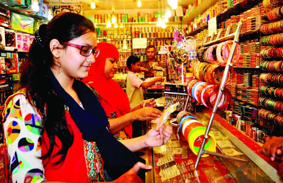 Female buyers crowded an immitation ornaments shop ahead of Eid-ul Fitr at Eastern Plaza Market in the city on Monday.