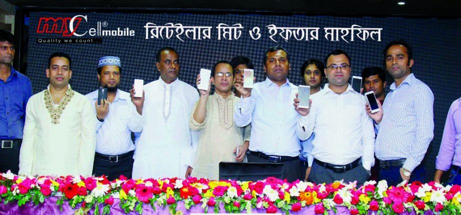 Md Abdul Huq, Chairman, Md Nahidul Islam, Director (Operation), Mohammad Mahbubur Rahman Mia, General Manager and senior officials of MyCell company pose with its new products Iron-1 and Iron-2 mobile handsets at a city convention center recently.