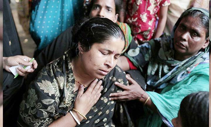 Well-wishers consoling a relative of a stampede victim of Godavari river in Andhara Pradesh on Tuesday.